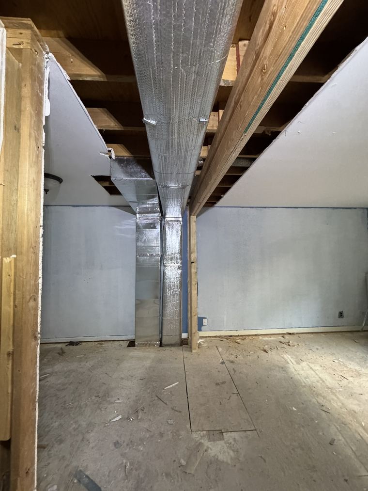New insulated sheet-metal ductwork installed in a basement