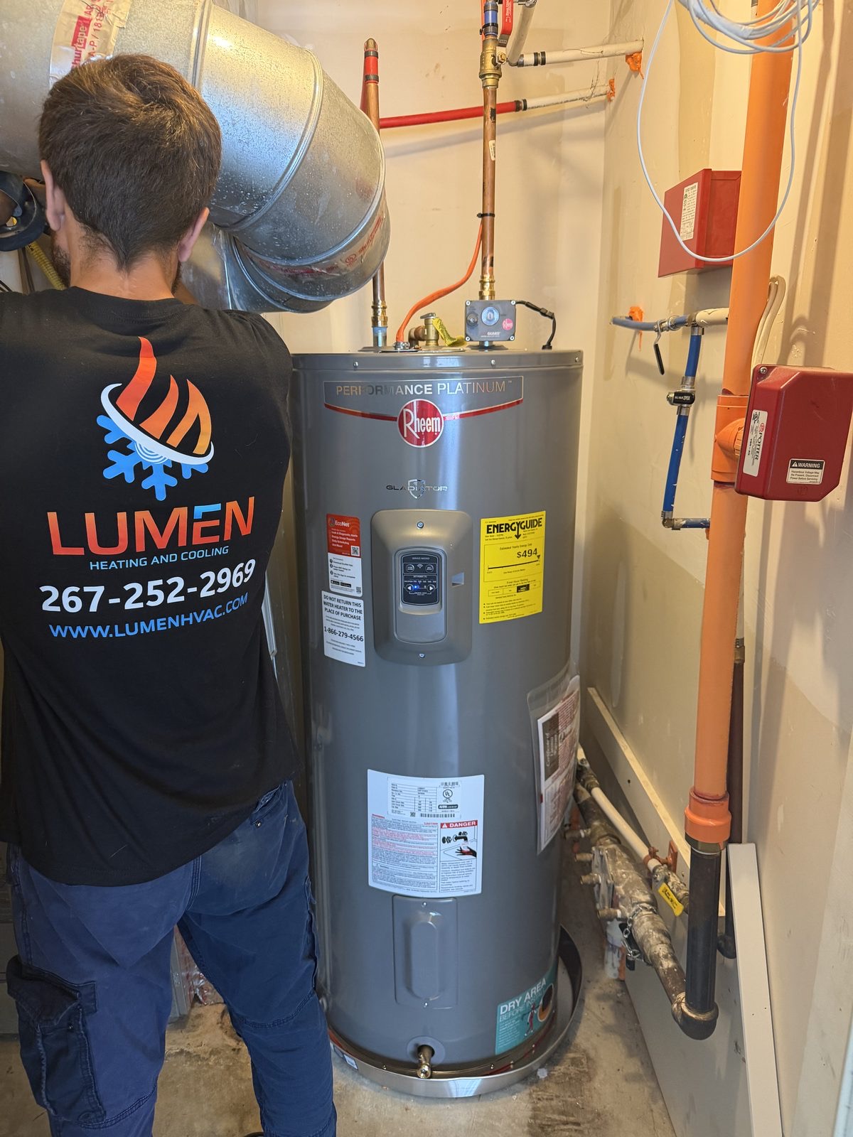 Lumen Heating and Cooling technician installing a water heater